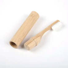 Load image into Gallery viewer, Bamboo toothbrush with wooden handle on a white background