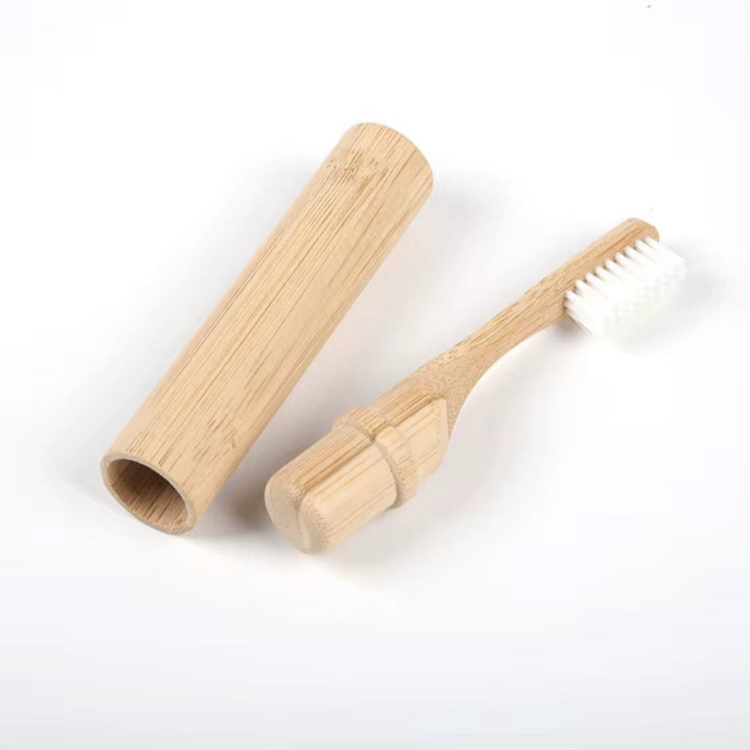Bamboo toothbrush with wooden handle on a white background